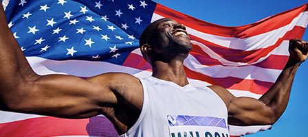 Champion poses proudly with flag