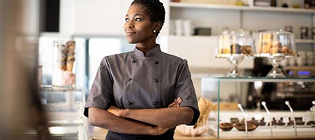 Chef standing confidently in a bakery