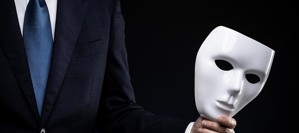 Businessman with mask, dark background
