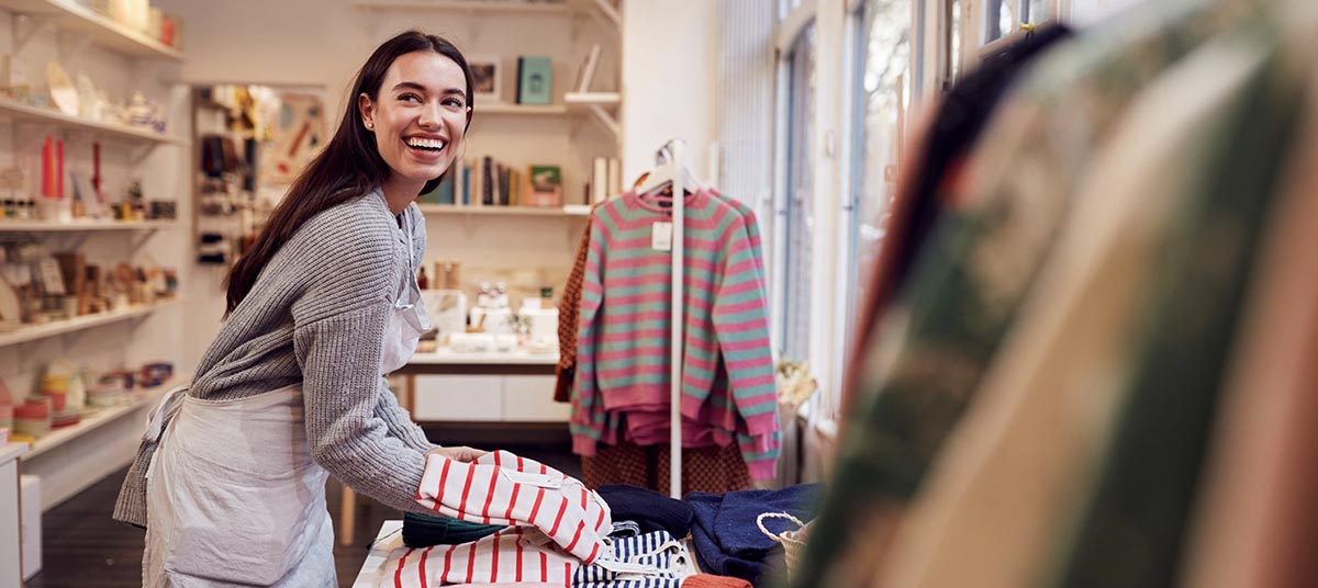 Woman smiling in boutique store