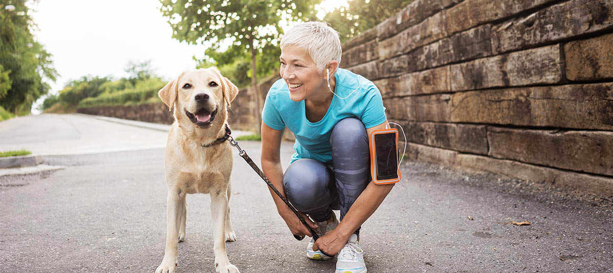 Woman jogging with her dog
