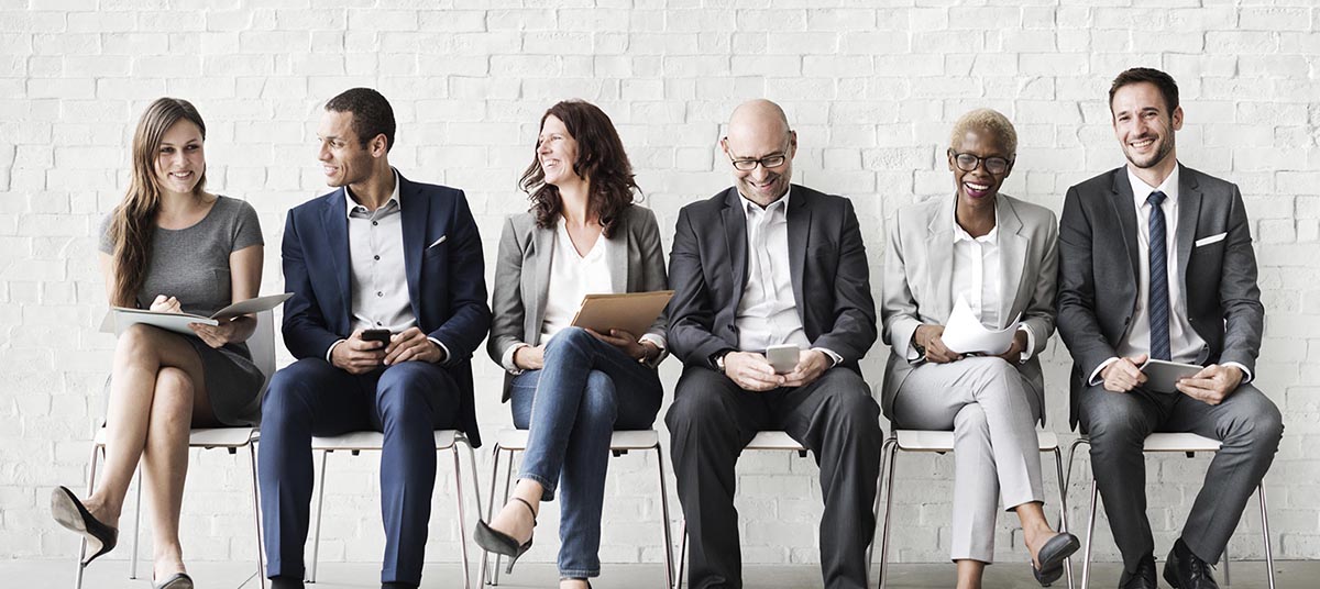 Diverse professionals sitting on chairs