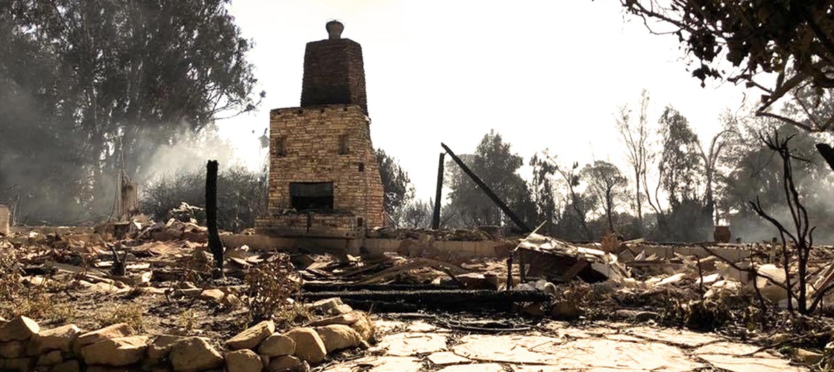 Fire aftermath with stone fireplace