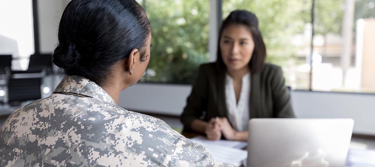 Military personnel in office meeting