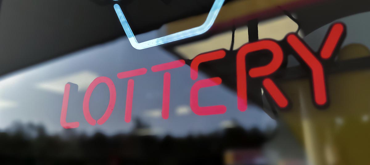 Red lottery sign reflection