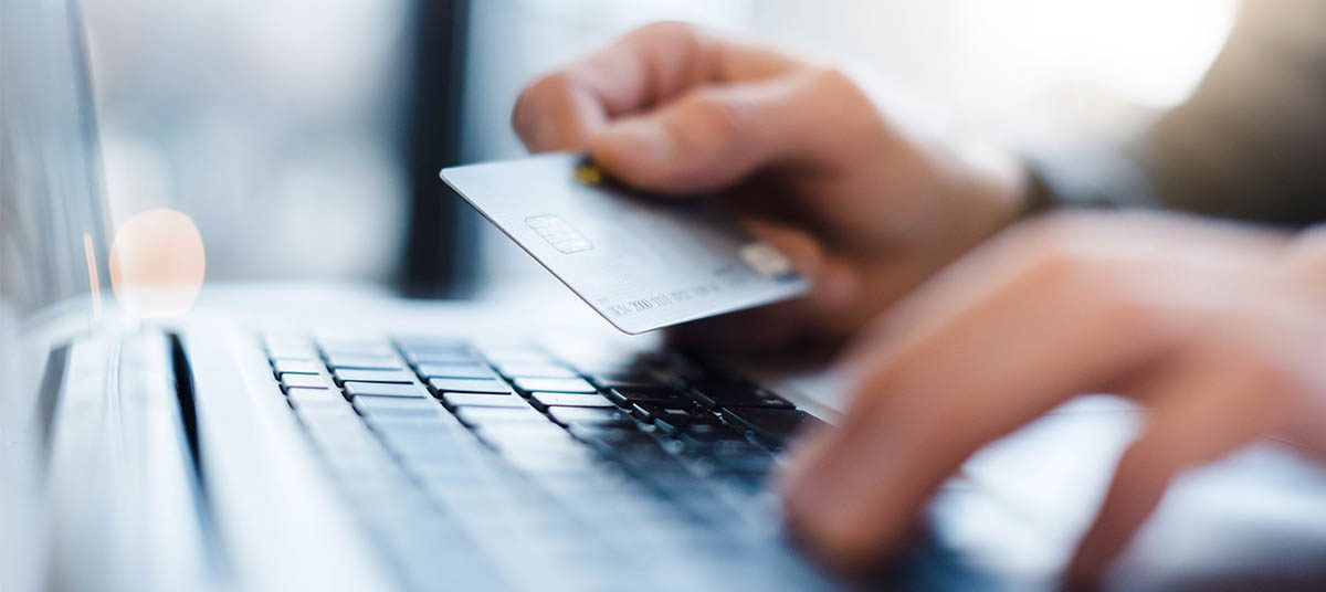 Person shopping online with credit card
