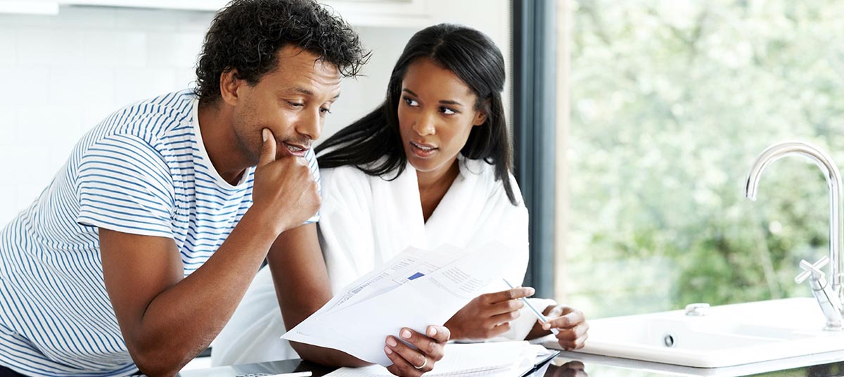 Pair analyzing financial papers together