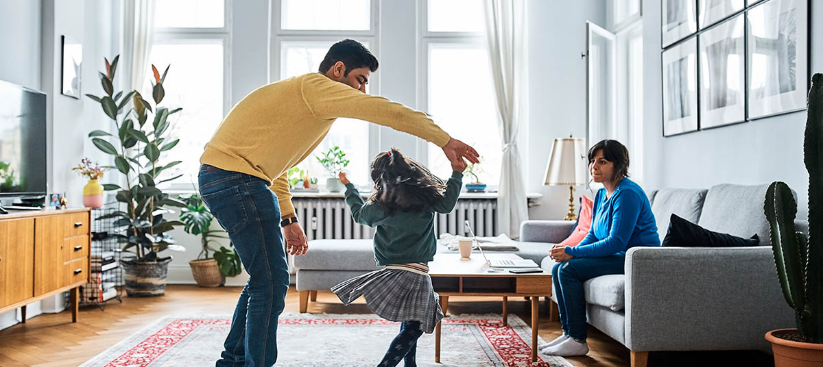 Child spinning joyfully with parent