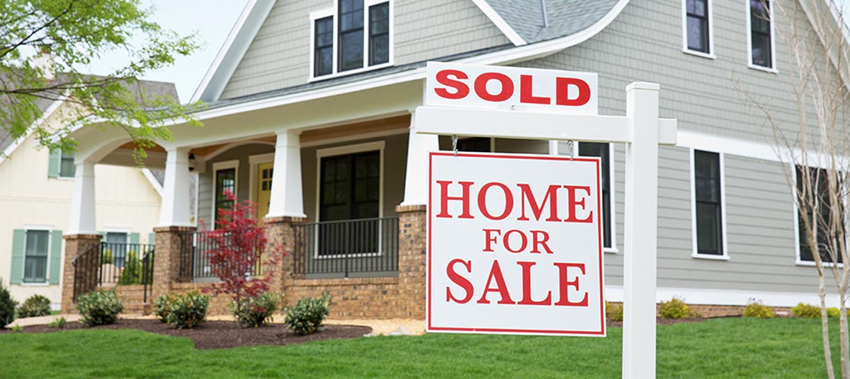 House with sold sign