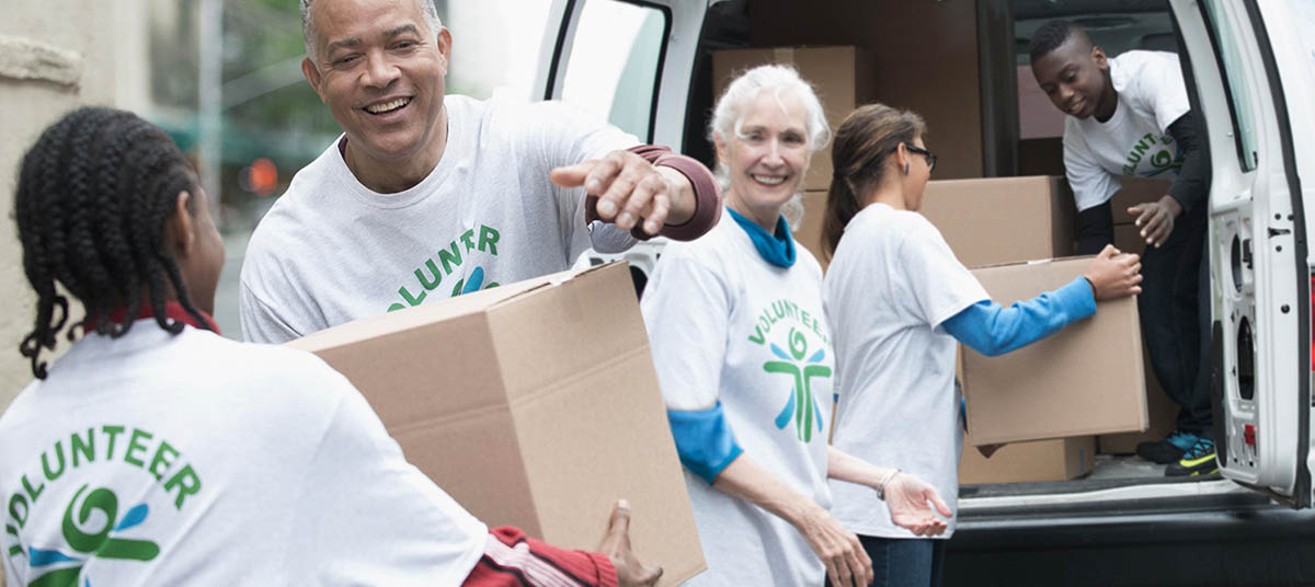 Group helping with donations delivery