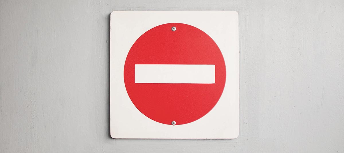 No entry road sign on wall