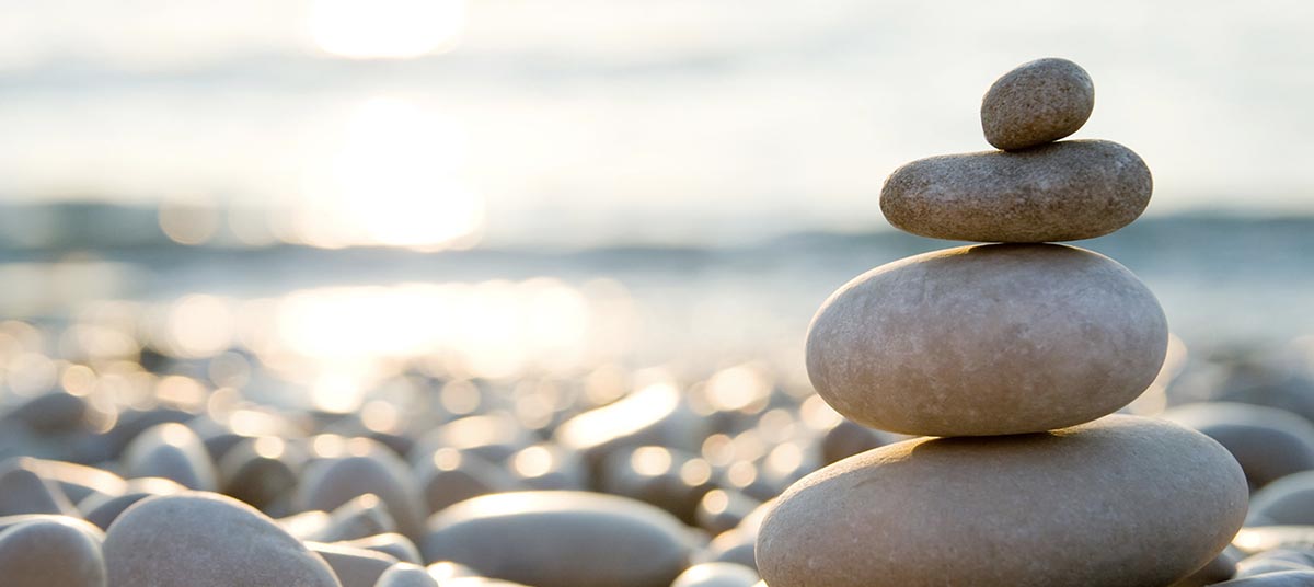 Balanced pebbles by the sea