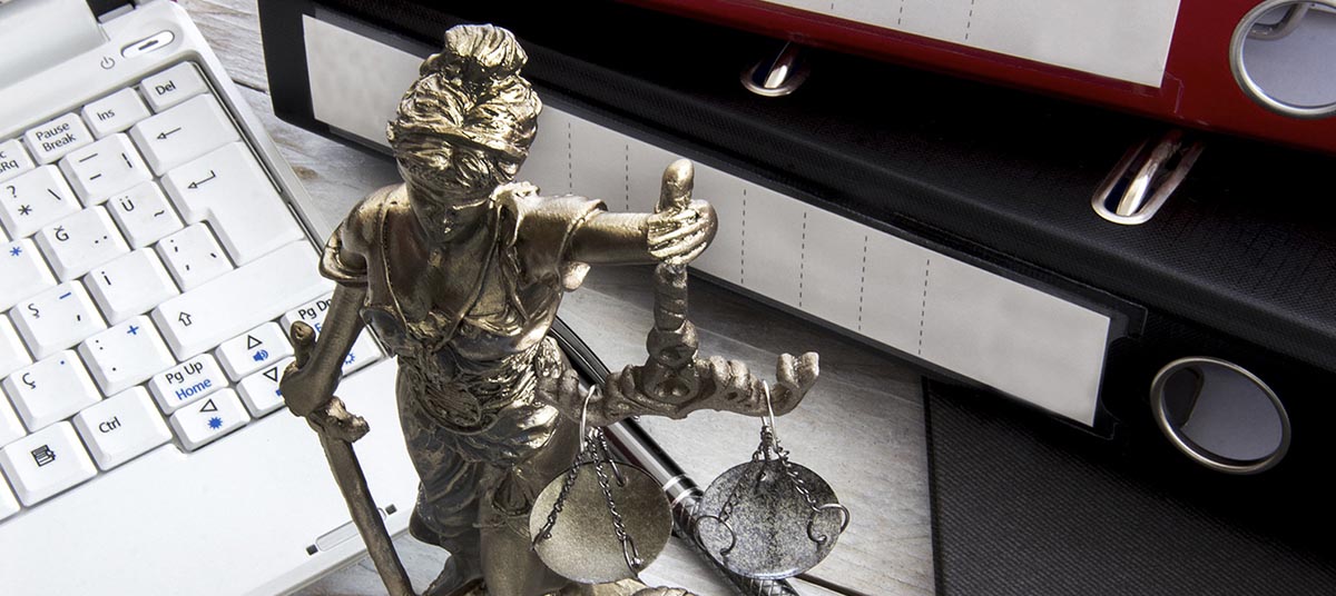Legal-themed desk with Lady Justice statue