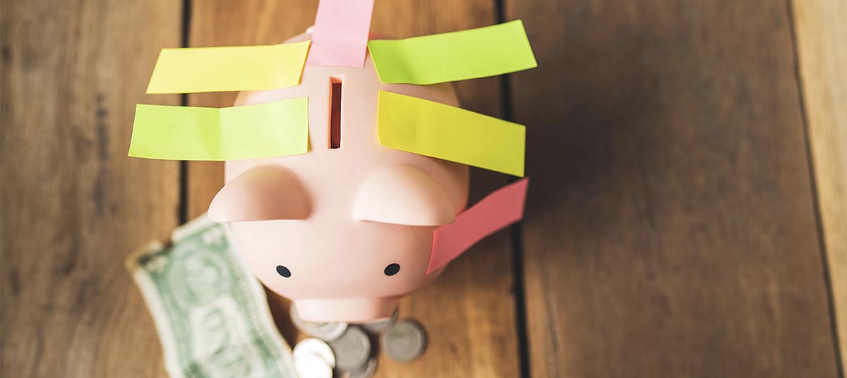 Savings concept with coins and dollar bill