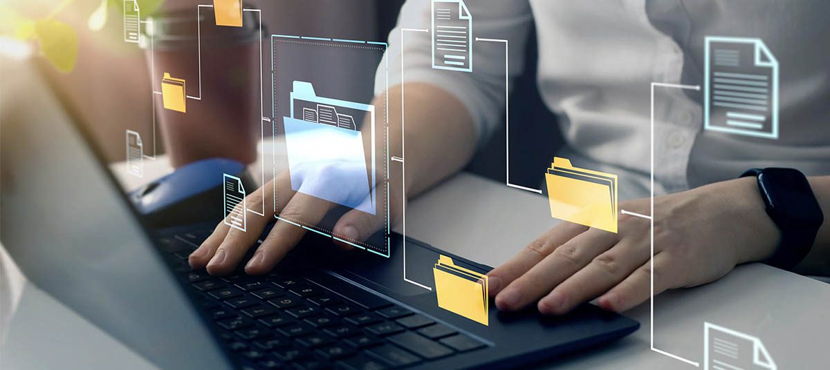 Hands typing with virtual file icons