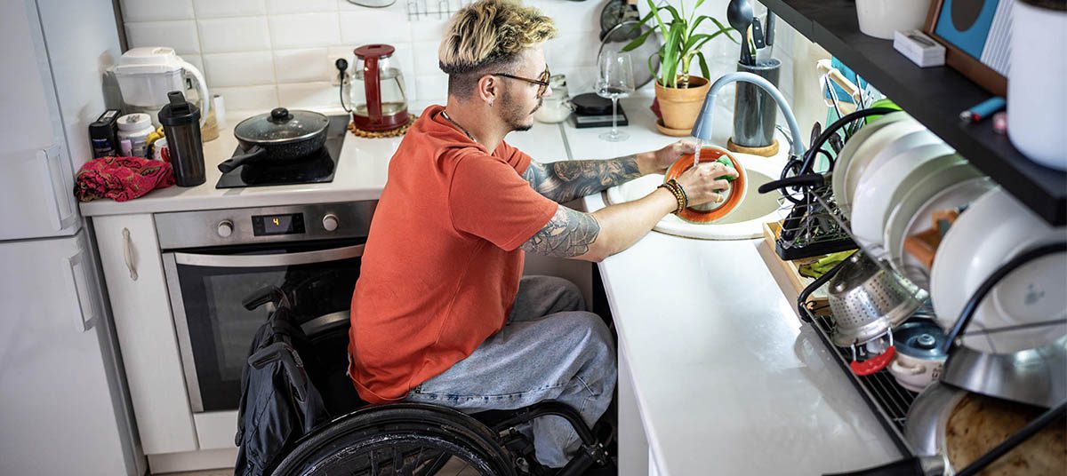 Man doing dishes in kitchen