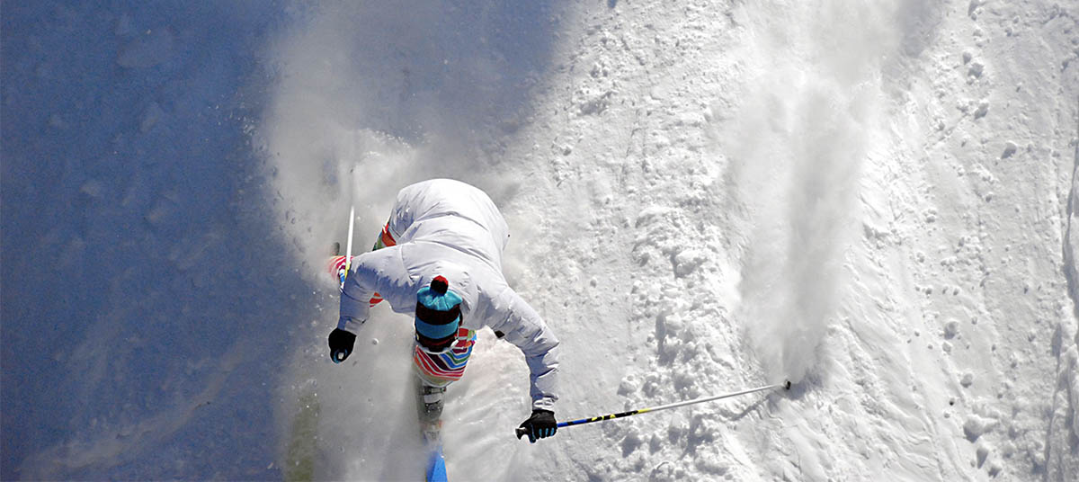 Winter sports athlete skiing fast