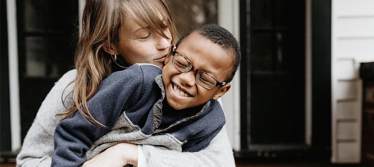 Joyful embrace with smiling child