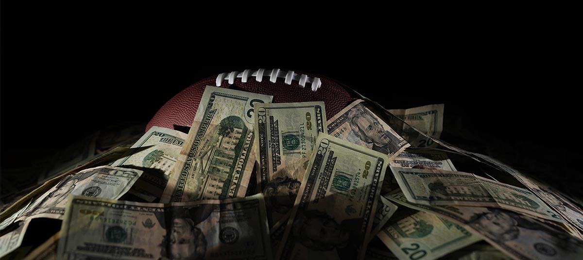 Sports betting imagery with cash and football