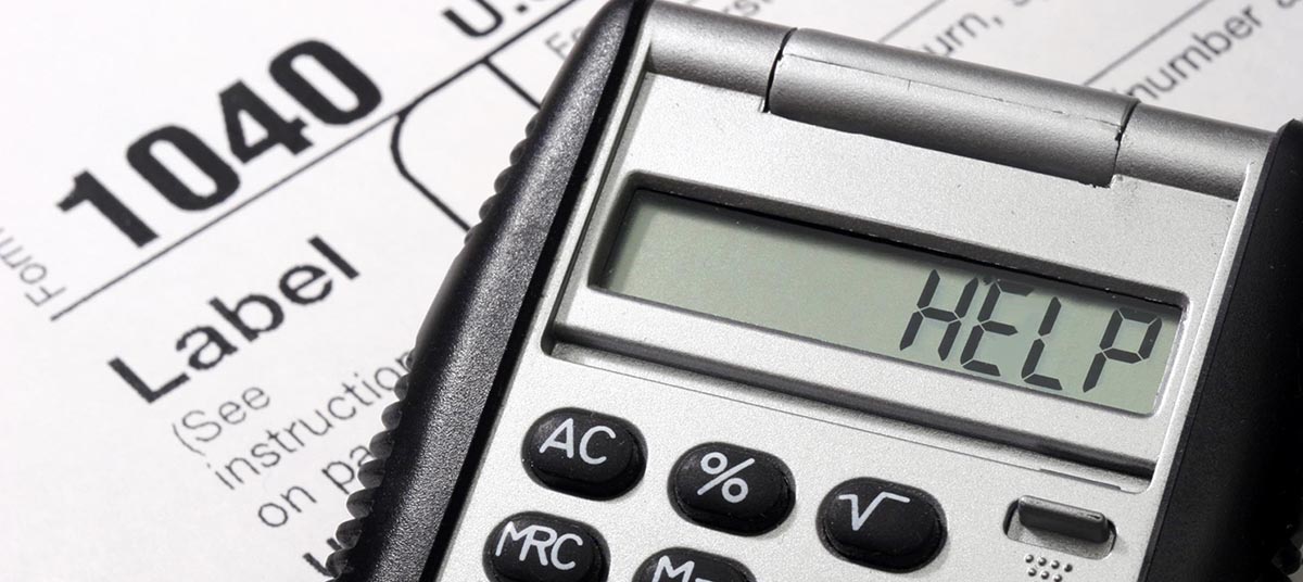 Calculator displaying "HELP" on tax form