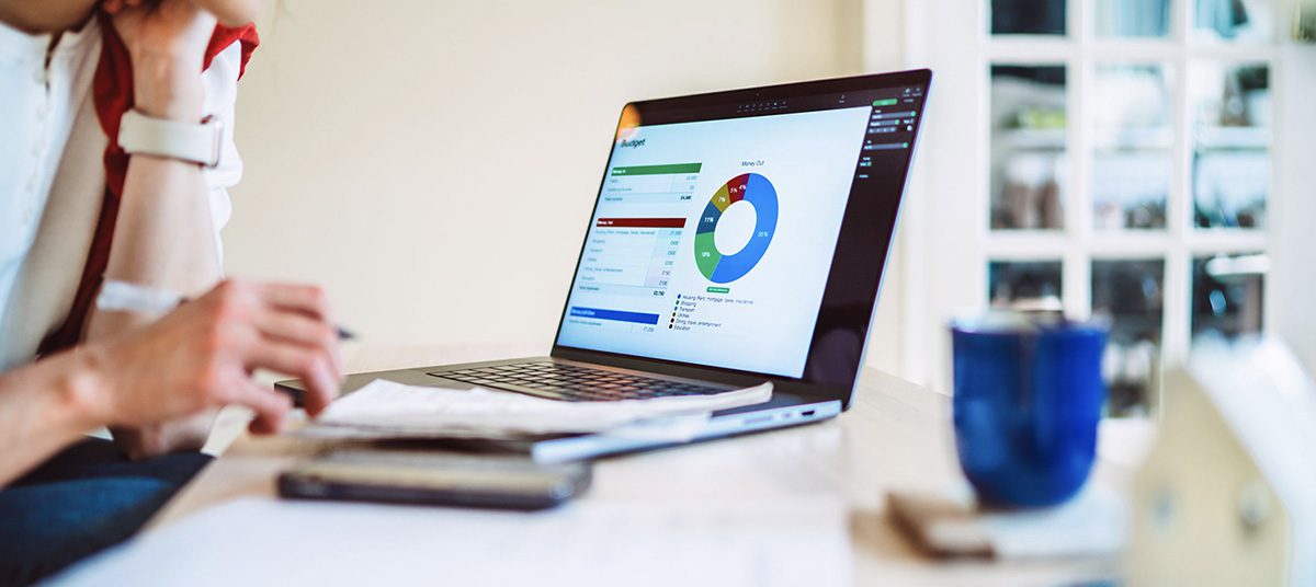 Laptop displaying colorful data chart