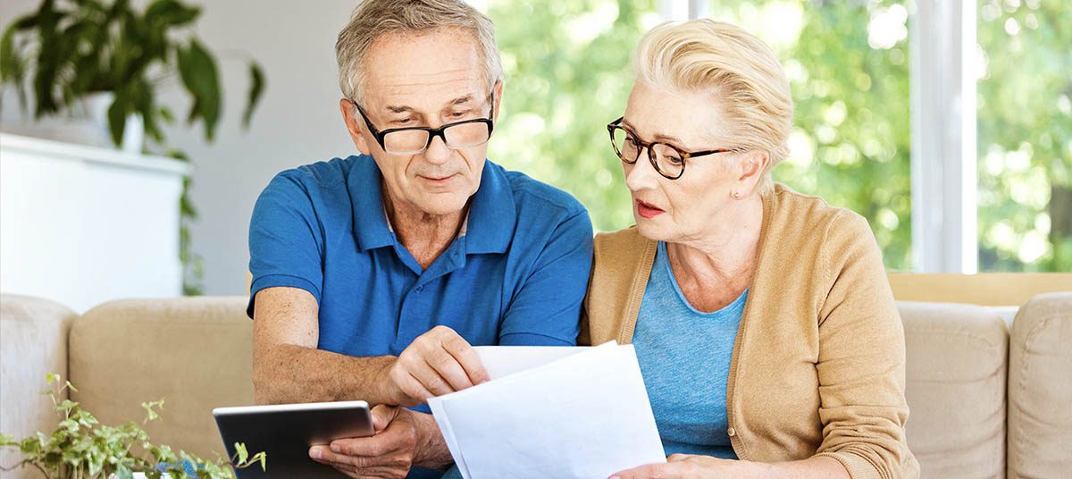 Senior couple reviewing documents together