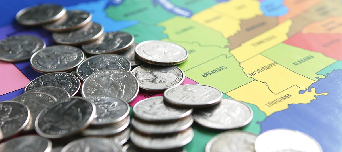 Coins scattered on a colorful map