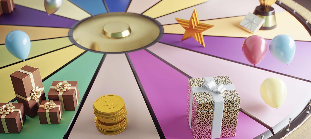 Spinning wheel with wrapped presents and coins.