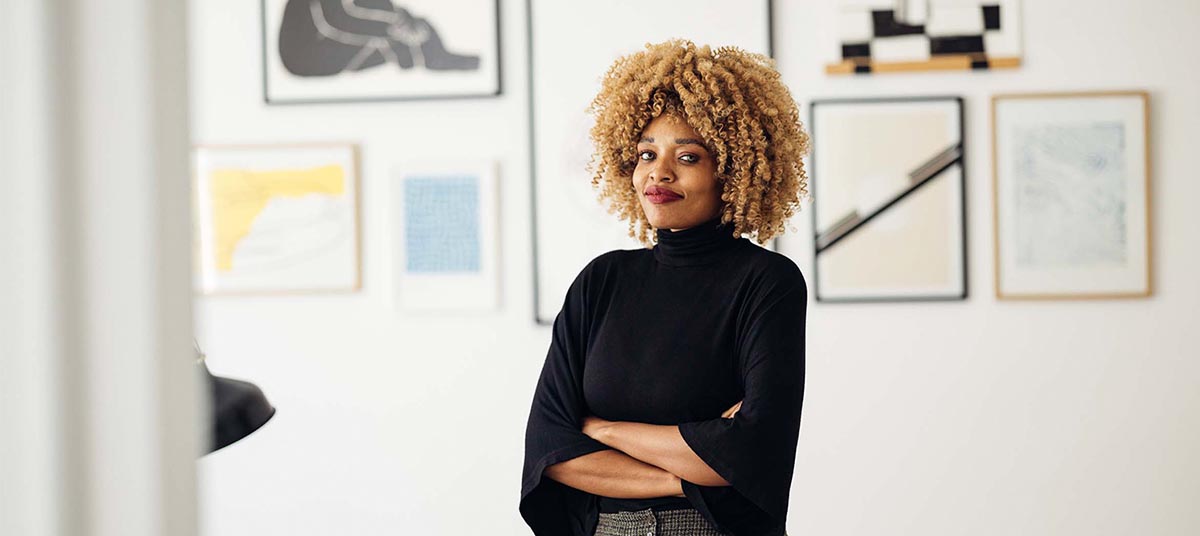Woman with curly hair in stylish outfit