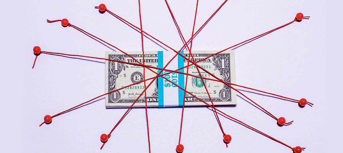 Cash wrapped in red strings on display