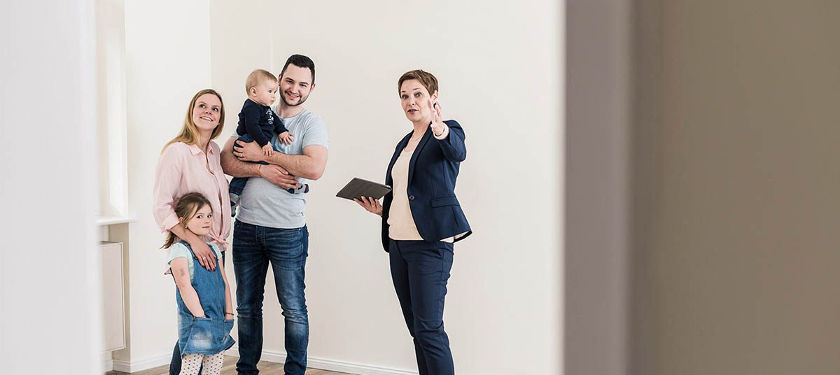 Real estate agent showing empty room