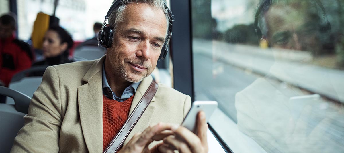 Man listening to music on bus