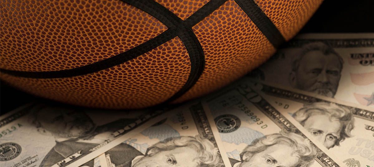 Cash under a basketball