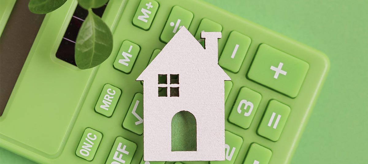 Green calculator with house cutout