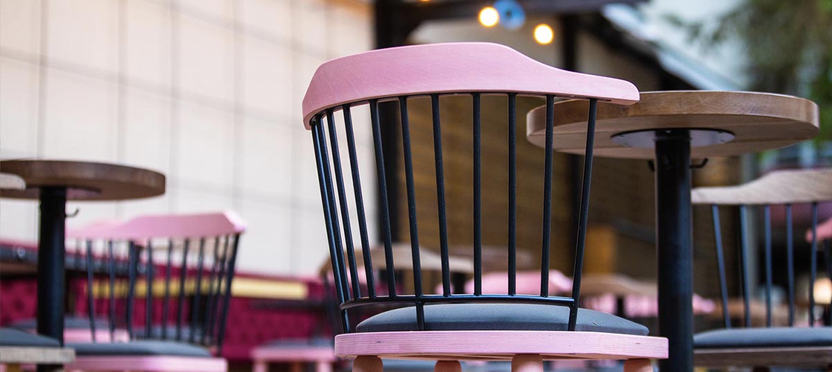 Modern outdoor seating with pink accents