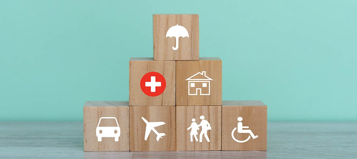 Stacked blocks showing different insurance symbols