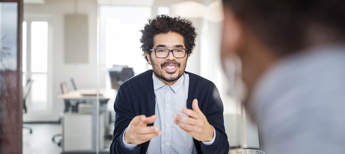 Professional discussion in modern workspace
