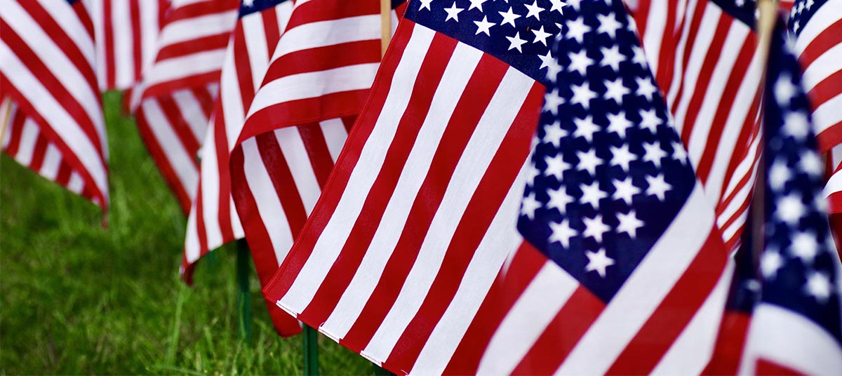 Multiple American flags displayed outdoors