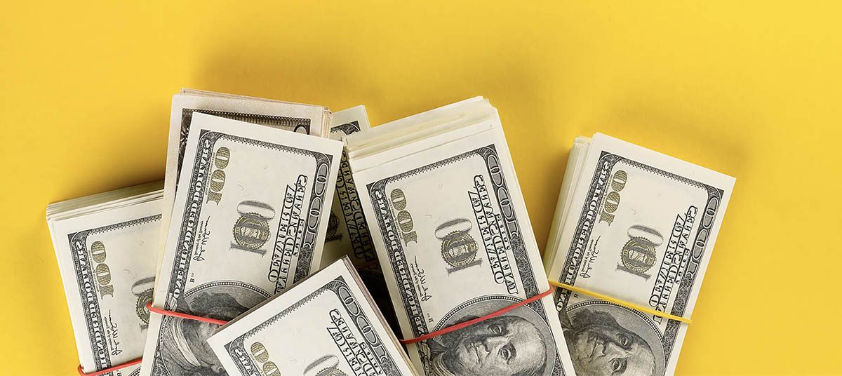 Bundles of cash with rubber bands