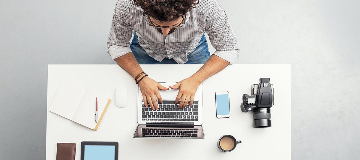 Overhead view of desk with gadgets