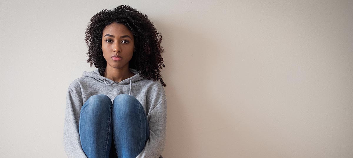 Pensive woman in casual attire