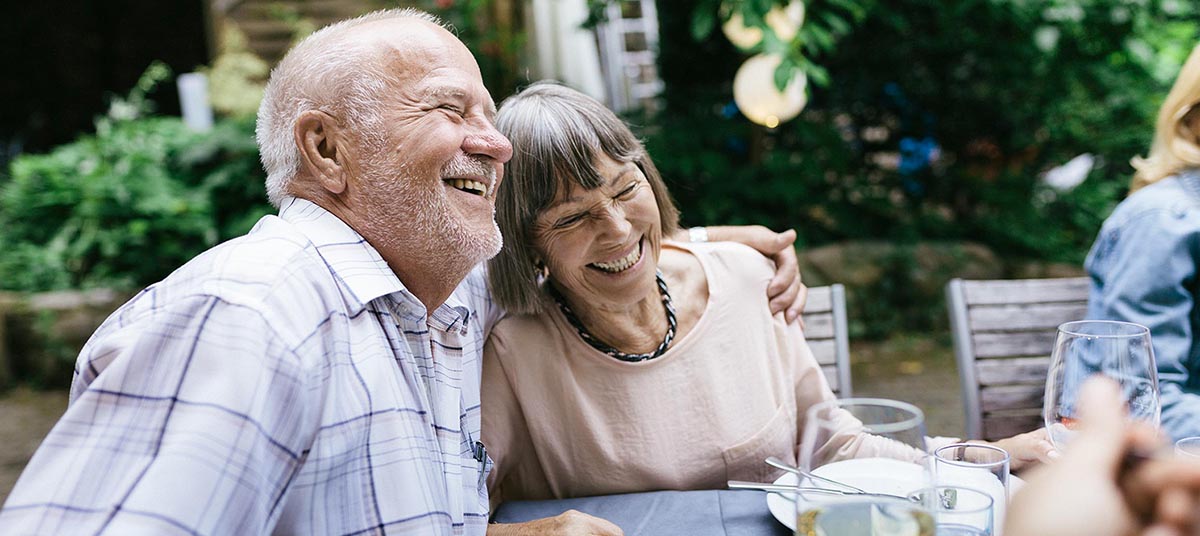 Happy couple at outdoor table