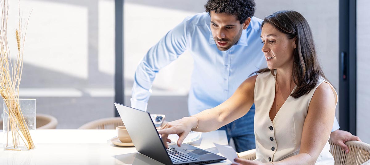 Office teamwork with computer discussion