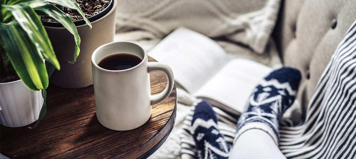 Cozy scene with coffee and book
