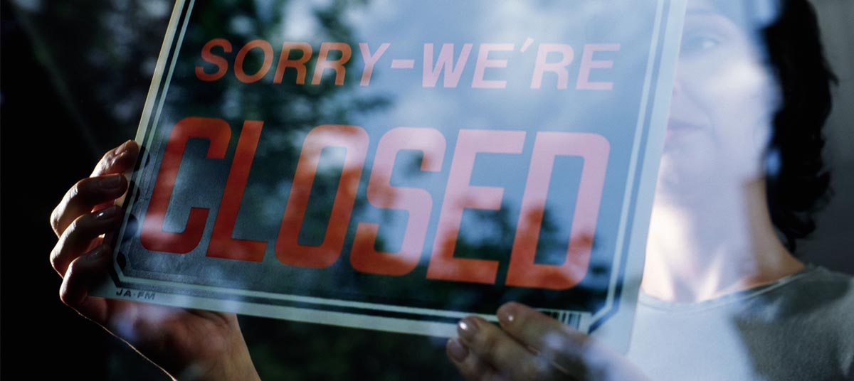 Reflective closed sign in window