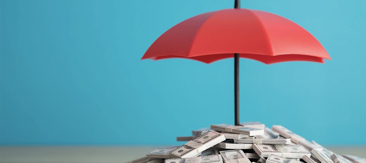 Financial security concept with red umbrella