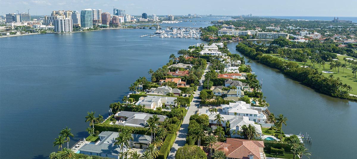 Aerial view of waterfront homes and city