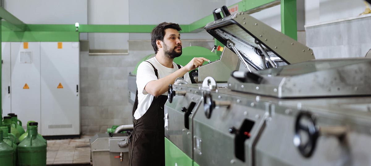 Worker operating industrial machinery