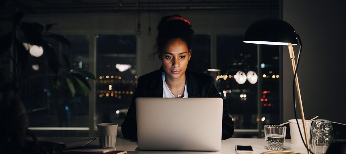 Woman working late on laptop