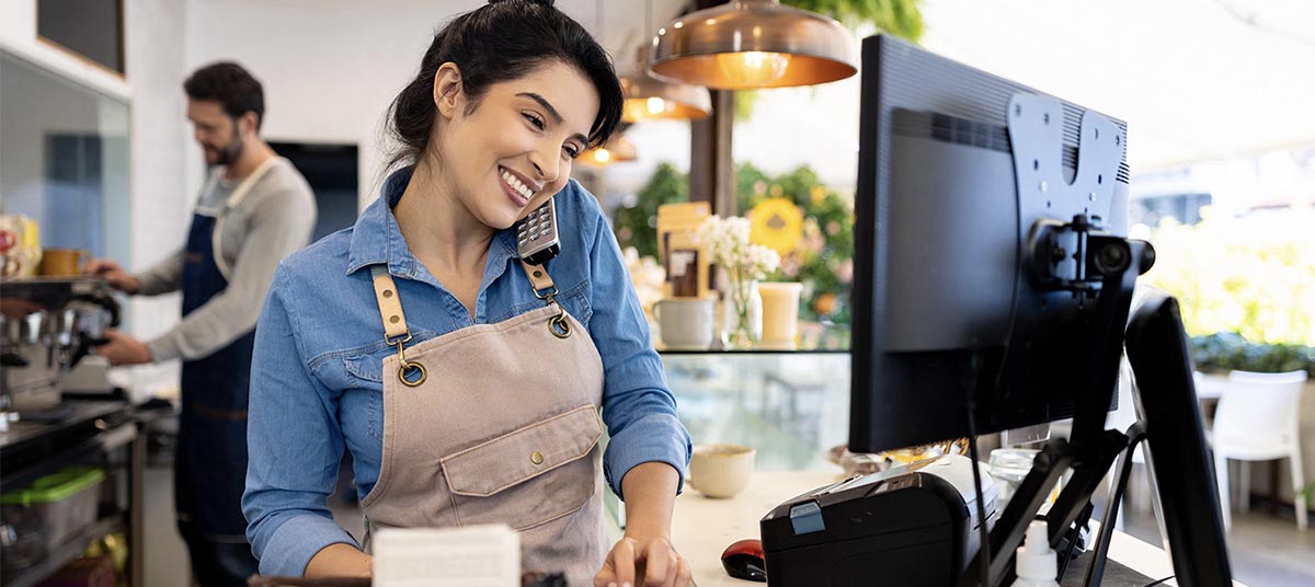 Barista multitasking at a café counter